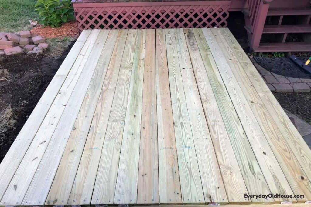 deck boards arranged in a single layer with even spacing and even