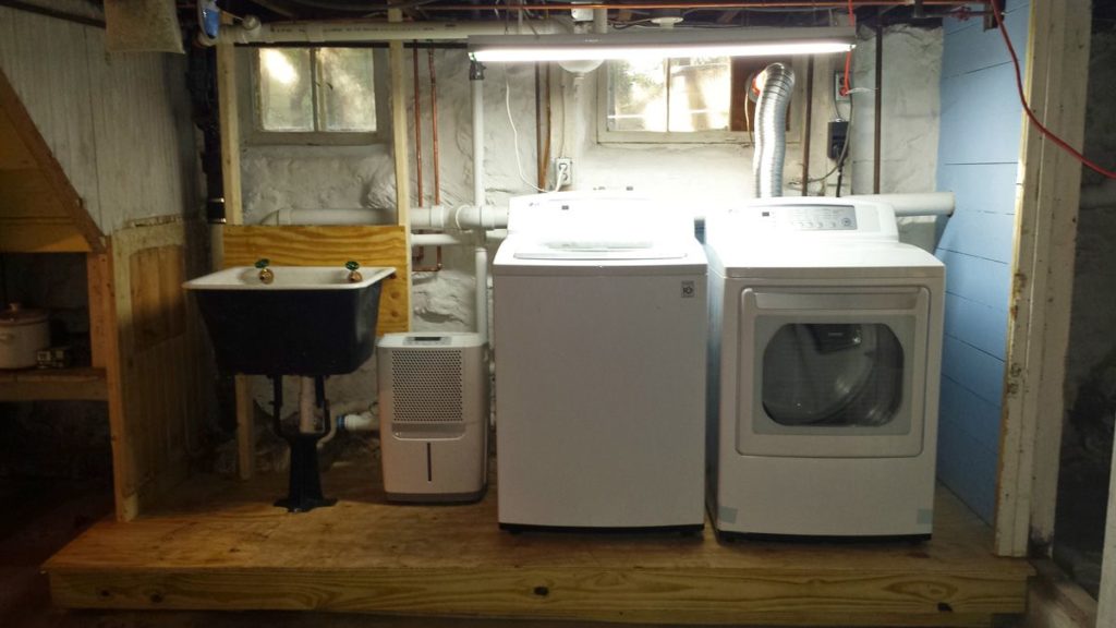 Basement set-up after we moved the Pittsburgh Potty and replaced with a much-needed slop sink to wash paintbrushes #oldbasements #laundrybasin