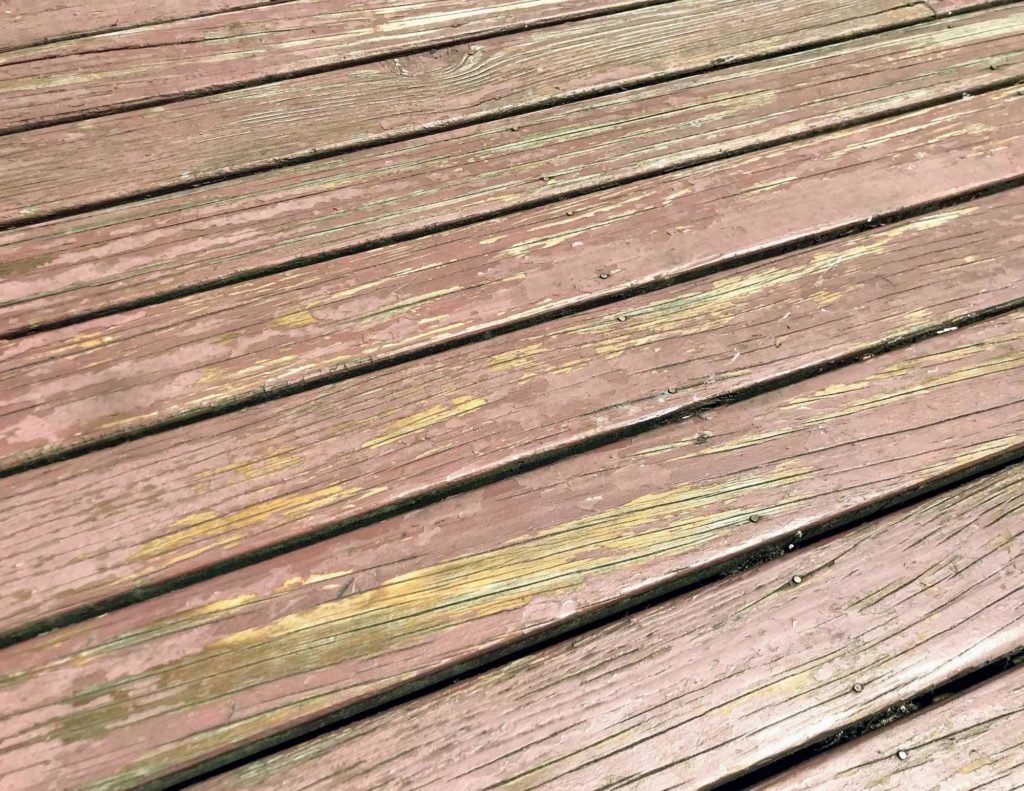 Close-up photo of deck floorboards before restoration #deckrestore #DIYbackyardprojects