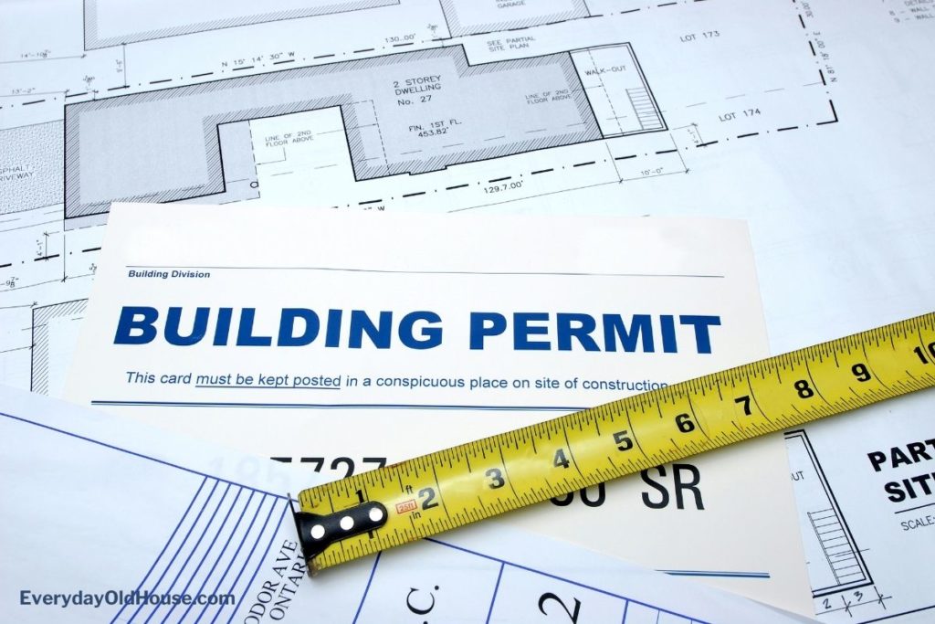 Building permit for home with ruler