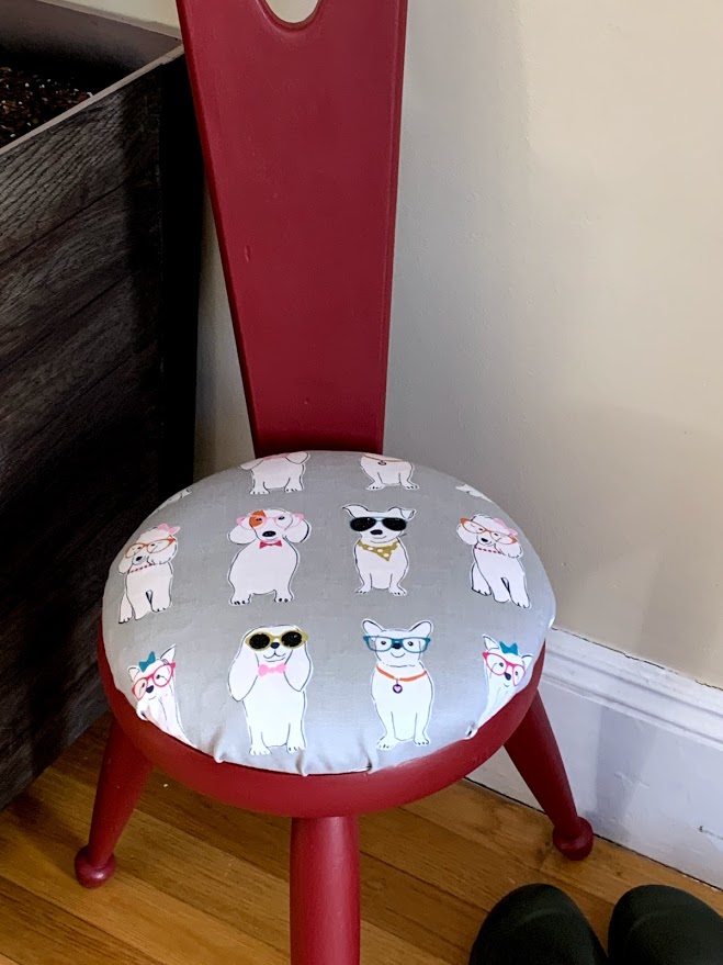 Dog pattern upholstery from Joann fabrics to upcycle vintage stool