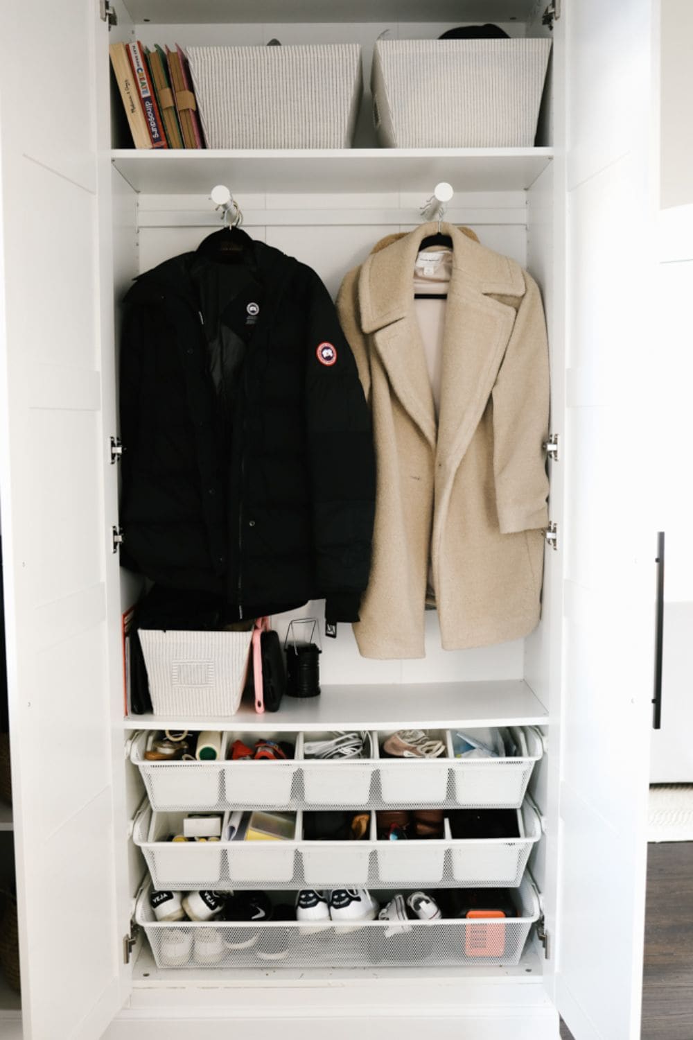 Double rod coat closet idea with rods side by side versus up and down. Coat closet solution ideas for small or awkward closets in old houses