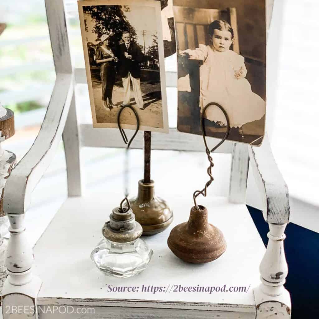 Vintage glass doorknobs repurposed into photo holders. https://2beesinapod.com/