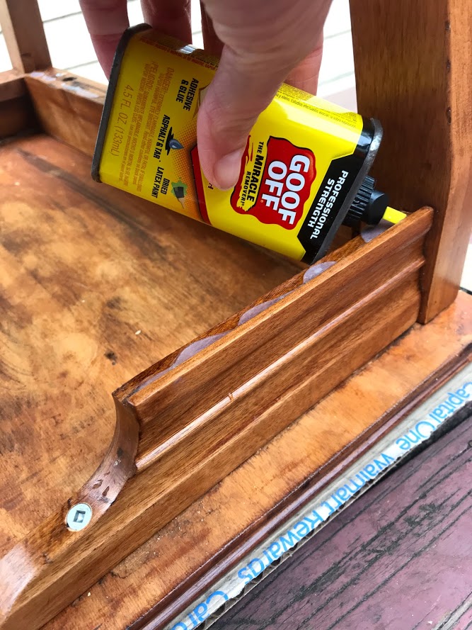 Removing old adhesive from wooden telephone chair with Goof Off #goofoff #furniturerestoration