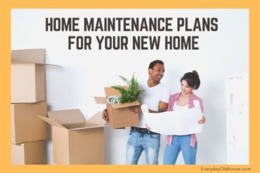 Couple with moving boxes entering new home needing a home maintenance plan