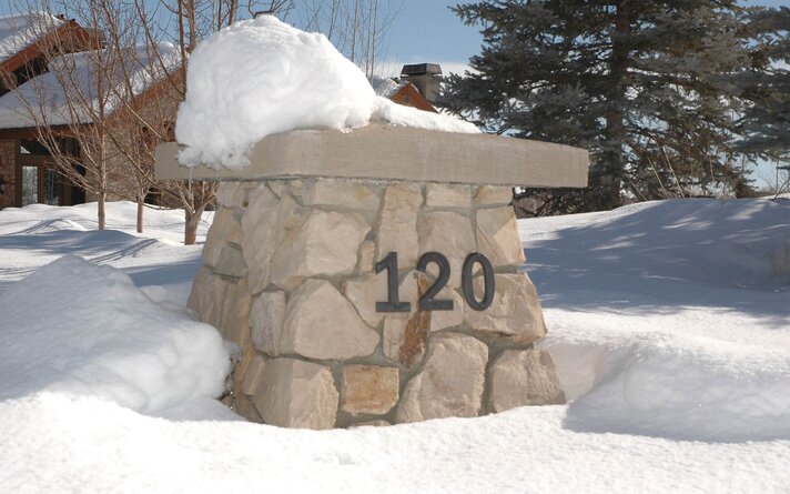 Gate entrance with highly visible house number by Perigold, Rocky Mountain style