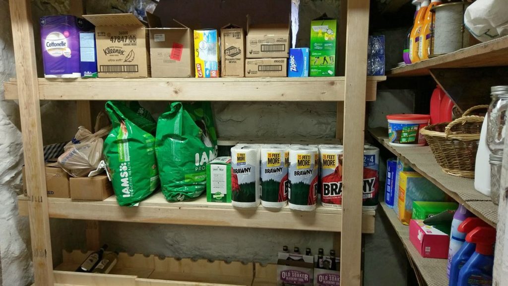 Got a little extra room in your basement? We added a few shelves and created the perfect place to store the extras that didn't fit in our linen or pantry closet #extrastorage #basementorganization