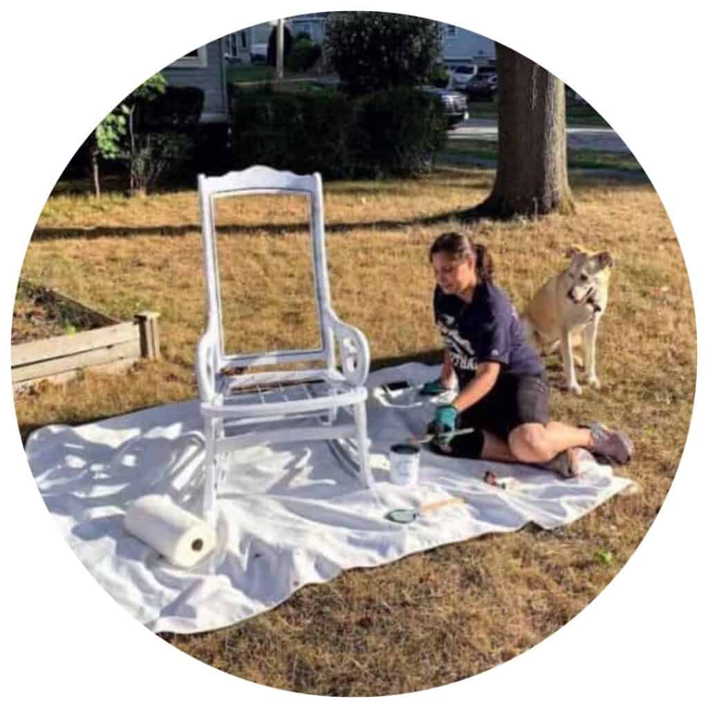 Everyday Old House LLC Founder and CEO, Jennifer Osterhout, restoring old chair with her dog overseeing over her shoulder