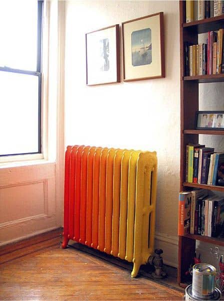 Beautiful example of inspiring and unique paint colors for cast iron radiators. Orange and yellow cast iron radiator via Pinterest.  Photo source unable to track.