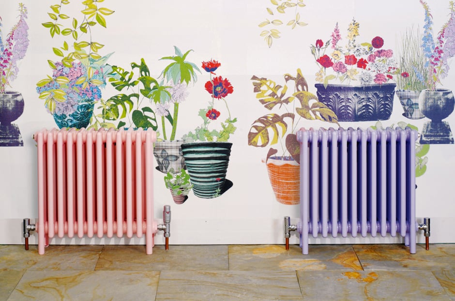 Beautiful example of inspiring and unique paint colors for cast iron radiators. Pink and purple painted radiators against a garden wallpaper. 
 #gardendecor #oldradiators