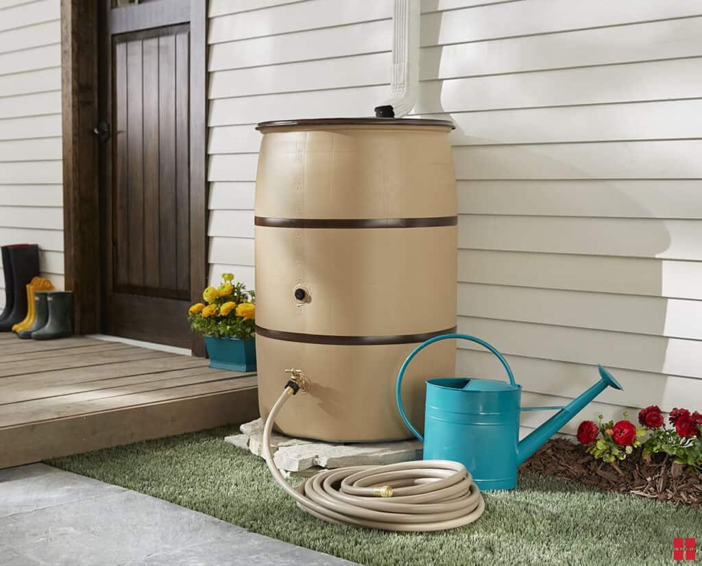 spiffy up a rain barrel with rustoleum spray paint to blend in with home
