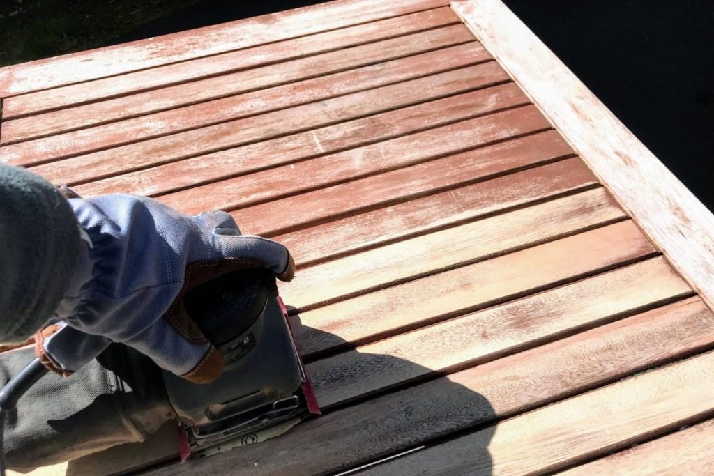 Power sanding to restore eucalyptus outdoor furniture back to original color