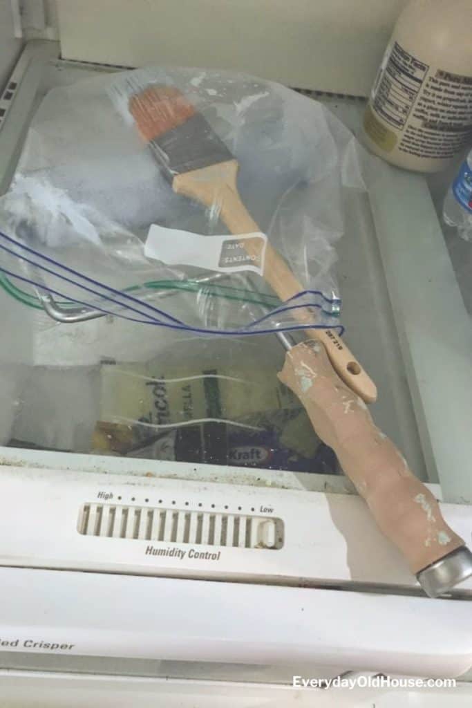 paint brush and roller in a plastic bag in a refrigerator