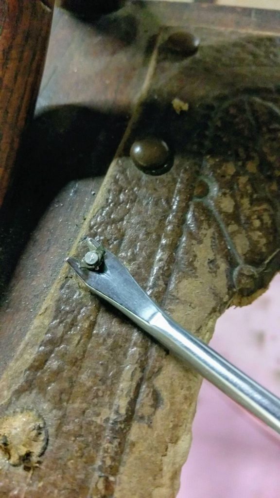 Tack remover used to remove seat remnants from old chair #tackremover #chairrestorationDIY