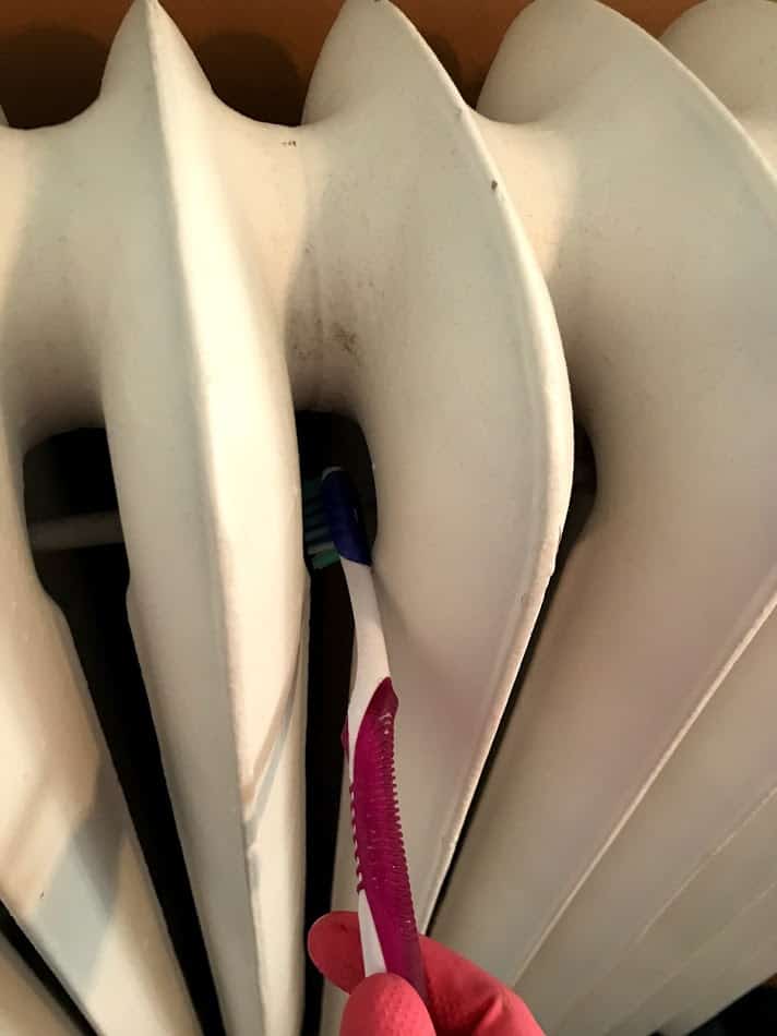 Use a toothbrush to get into fins of a radiator #otherusesfortoothbrush #cleanradiator