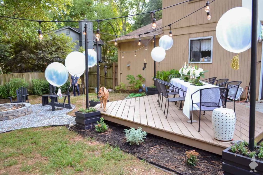 Ugly Duckling House floating deck landscaping ideas. Courtesy of https://www.uglyducklinghouse.com/outdoor-light-pole-planters-plans/