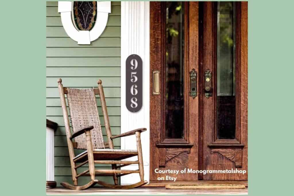front of old house with porch chair and metal visible number on front porch. Courtesy of Monogrammetalshop on Etsy