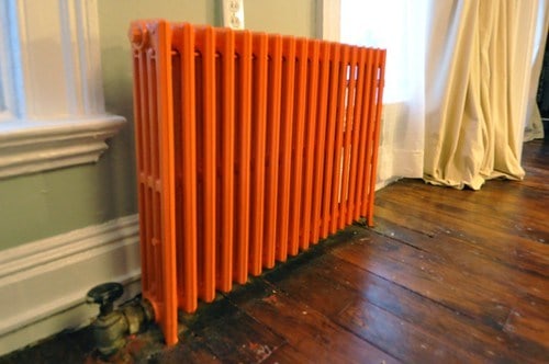 Brighten your room with an orange cast iron radiator on viewed on Brick City Love #oldradiator #colorpop