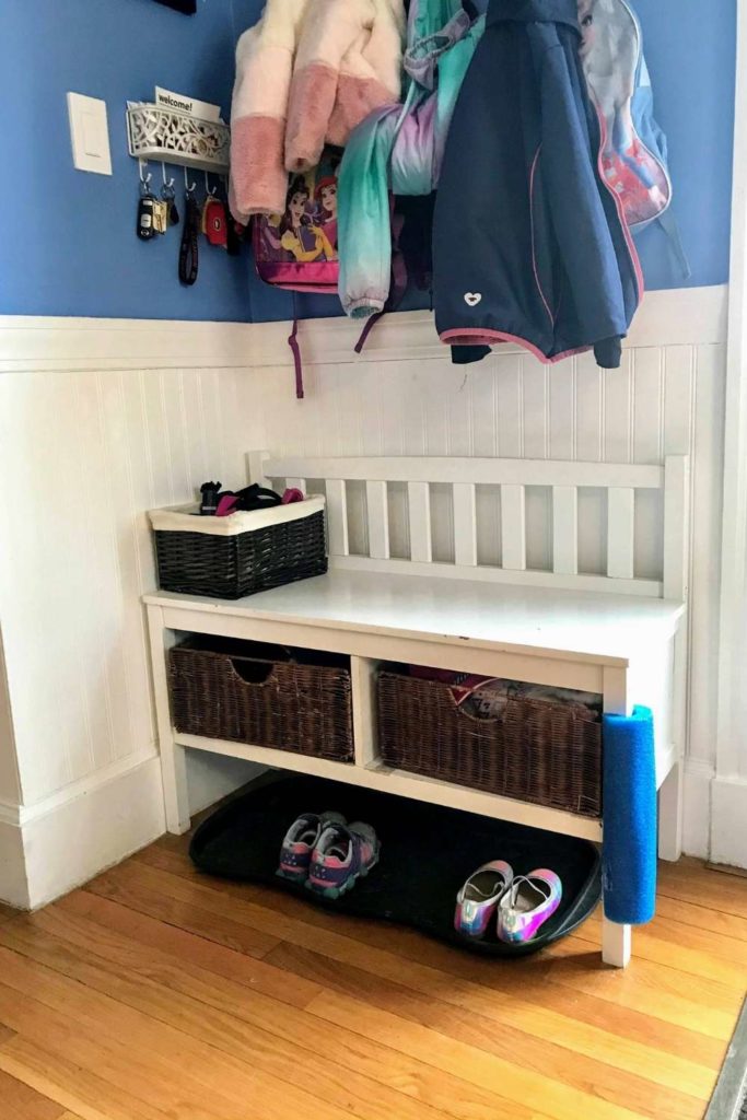 Protecting mudroom bench from door that slams using a furniture bumper
