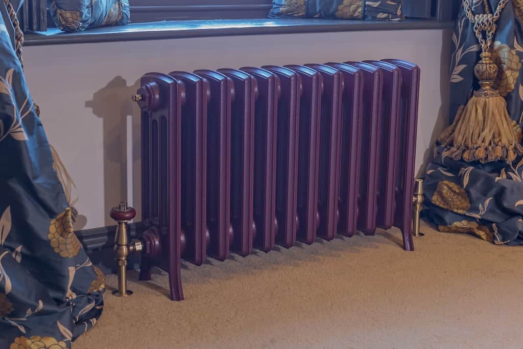 Beautiful example of inspiring and unique paint colors for cast iron radiators.  Deep royal purple cast iron radiator #paladinradiators #paintcastironradiators